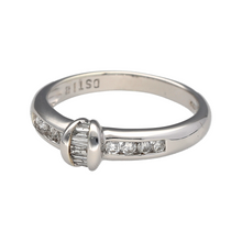 Load image into Gallery viewer, New 9ct White Gold &amp; Diamond Set Band Ring in size P with the weight 3.50 grams. There is approximately 0.33ct of diamond content set in total. The ring is made up of baguette cut diamonds in the center and brilliant cut diamonds set in the shoulders
