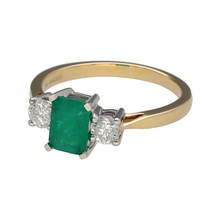 Load image into Gallery viewer, New 9ct Yellow and White Gold 0.42ct Diamond &amp; Emerald Set Trilogy Ring in size N with the weight 2.50 grams. The emerald stone is 7mm by 5mm and there is approximately 0.42ct of diamond content in total
