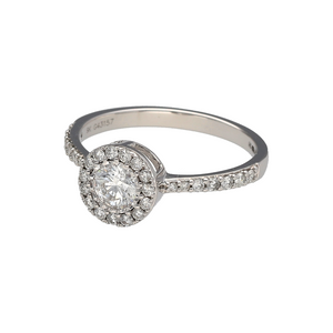 New 9ct White Gold & 0.61ct Diamond Set Brilliant Cut Halo Ring in size N with the weight 2.10 grams. There is approximately 0.61ct of diamond content set in total at approximate clarity Si2 and colour H. The front of the ring is 8mm high and the shoulders are diamond set on half the band