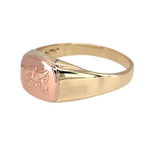 Load image into Gallery viewer, Add a bold and symbolic piece to your jewellery collection with this pre-owned 9ct yellow and rose gold Clogau Welsh Dragon signet ring, featuring:

Design: A classic signet ring showcasing the iconic Welsh Dragon, symbolising strength and heritage.
Material: 9-carat yellow and rose gold, creating a striking two-tone contrast.
Size &amp; Weight: Designed in size N, with a solid weight of 4.80 grams for a comfortable and durable feel.
Front Dimensions: Measures 9mm high, making it a refined yet noticeable piece.
