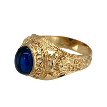 Load image into Gallery viewer, New 9ct Yellow Gold &amp; Blue Stone Graduation/University Ring in size W to X with the weight 8.40 grams. The blue stone is 10mm by 8mm and the front of the ring is 17mm high. The ring says &#39;University of Life&#39; and has patterned shoulders
