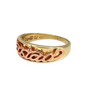 Preowned 9ct Yellow and Rose Gold Clogau Cariad Band Ring in size Q with the weight 4.80 grams. The front of the ring is 7mm wide