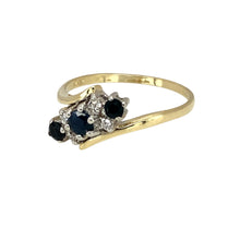 Load image into Gallery viewer, Preowned 9ct Yellow and White Gold Diamond &amp; Sapphire Set Twist Ring in size Q to R with the weight 2.10 grams. The center sapphire stone is approximately 4mm diameter
