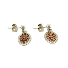 Load image into Gallery viewer, Add a touch of elegance and heritage to your jewellery collection with these pre-owned 925 silver with 9ct rose gold &amp; diamond set Clogau Celtic knot drop earrings, featuring:

Design: Intricate Celtic knot drop earrings, symbolising eternity and interconnectedness.
Material: A combination of 925 sterling silver and 9-carat rose gold, creating a striking two-tone contrast.
Gemstones: Set with diamonds, adding a subtle sparkle to the design.

