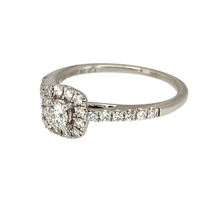 Preowned 18ct White Gold & Diamond Set Halo Ring in size K with the weight 2.80 grams. The front of the ring is 7mm high and there is approximately 0.39ct of diamond content set in total. The ring has diamond set shoulders