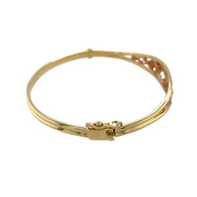 Load image into Gallery viewer, Preowned 9ct Yellow and Rose Gold Clogau Tree of Life Bangle with the weight 12.40 grams. The front of the bangle is 11mm high and the diameter of the bangle is 6.5cm
