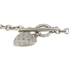 Load image into Gallery viewer, Add a touch of elegance to your jewellery collection with this stunning pre-owned 9ct white gold &amp; diamond set heart charm bracelet, featuring:

Design: A delicate 7&quot; bracelet adorned with a beautifully crafted heart charm, enhanced by shimmering diamonds for a timeless and romantic appeal.

Material: Expertly crafted from 9-carat white gold, offering a sleek and sophisticated finish.

Weight: A comfortable 5.30 grams, ensuring durability while maintaining a lightweight feel.

Charm Dimensions: The heart ch
