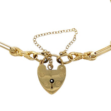 Load image into Gallery viewer, Add a charming and elegant piece to your jewellery collection with this pre-owned 9ct yellow gold open fancy link heart padlock bracelet, featuring:

Design: A classic open fancy link bracelet, finished with a heart padlock clasp for a vintage-inspired touch.
Material: 9-carat yellow gold, offering a warm and timeless appeal.
Weight: A substantial 14.50 grams, ensuring durability while remaining comfortable to wear.
Link Width: 5mm, creating a bold yet refined look.
Safety Feature: Includes a safety chain f
