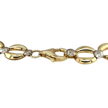 Load image into Gallery viewer, Add a distinctive and stylish piece to your jewellery collection with this pre-owned 9ct yellow and white gold open circular link weave bracelet, featuring:

Design: An intricate open circular link weave, creating a bold and elegant look.
Material: 9-carat yellow and white gold, offering a striking two-tone contrast.
Length: 7.5 inches, providing a comfortable fit for everyday wear.
Weight: A well-balanced 7.60 grams, ensuring durability without compromising on comfort.
