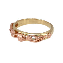 Load image into Gallery viewer, Add a meaningful and elegant piece to your jewellery collection with this pre-owned 9ct yellow and rose gold Clogau Tree of Life band ring, featuring:

Design: A beautifully detailed Tree of Life motif, symbolising growth, strength, and heritage.
Material: Crafted from 9-carat yellow and rose Welsh gold, offering a unique and timeless appeal.
Width: The front of the band measures 5mm, creating a refined yet striking look.
Size &amp; Weight: Designed in size M
