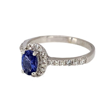 Load image into Gallery viewer, Preowned 18ct White Gold Diamond &amp; Tanzanite Set Halo Ring in size O with the weight 3.20 grams. The tanzanite stone is 6mm by 4mm
