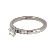 Load image into Gallery viewer, Preowned 9ct White Gold &amp; Diamond Set Clogau Solitaire Ring in size O with the weight 2.60 grams. The center diamond is approximately 20pt and the shoulders are set with diamonds. The diamonds are approximate clarity VS2 - Si1 and colour K - M
