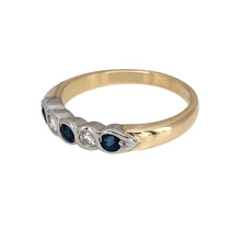 Load image into Gallery viewer, Preowned 9ct Yellow and White Gold Diamond &amp; Sapphire Rubover Set Band Ring in size Q with the weight 3.30 grams. The sapphire stones are each approximately 3mm diameter and the diamonds are each approximately 8pt each
