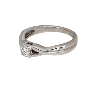 Preowned 18ct White Gold & Diamond Set Solitaire Twist Ring in size J with the weight 3 grams. The diamond is approximately 20pt with approximate clarity Si2 and colour J - K