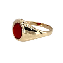 Load image into Gallery viewer, Preowned 9ct Yellow Gold &amp; Carnelian Set Oval Signet Ring in size N with the weight 3 grams. The front of the ring is 10mm high and the carnelian stone is 8mm by 6mm
