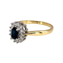 Load image into Gallery viewer, Preowned 18ct Yellow and White Gold Diamond &amp; Sapphire Set Cluster Ring in size Q with the weight 3.90 grams. The sapphire stone is 6mm by 4mm and there is approximately 21pt of diamond content
