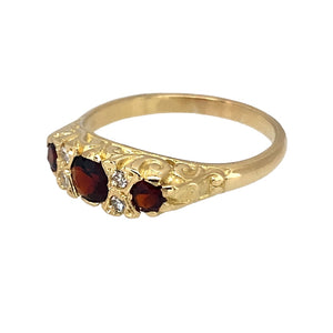 Preowned 18ct Yellow Gold Diamond & Garnet Set Antique Style Ring in size R with the weight 4.60 grams. The front of the ring is 6mm high and the center garnet stone is 4mm diameter