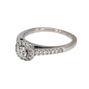 Preowned 18ct White Gold & Diamond Set Halo Ring in size M with the weight 3.80 grams. The ring has a diamond set band and there is approximately 30pt of diamond content in total. The front of the ring is 7mm high