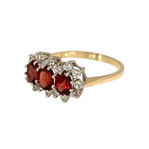 Preowned 9ct Yellow and White Gold Garnet & Cubic Zirconia Set Trilogy Cluster Ring in size O with the weight 2.50 grams. The garnet stones are each 5mm by 4mm