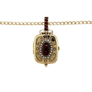 Preowned 9ct Yellow Gold Garnet & Seed Pearl Patterned Locket Pendant on an 18" curb chain with the weight 8 grams. The pendant is 3.7cm long including the bail and the garnet stone is 9mm by 5mm