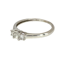 Load image into Gallery viewer, Preowned 14ct White Gold &amp; Diamond Set Princess Cut Trilogy Ring in size M with the weight 1.80 grams. There is approximately 0.25ct of diamond content in total
