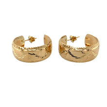 Load image into Gallery viewer, Add a touch of elegance and texture to your jewellery collection with these pre-owned 9ct yellow gold patterned half hoop stud earrings, featuring:

Design: Stylish half hoop stud earrings, enhanced with an intricate patterned finish for added detail and sophistication.
Material: 9-carat yellow gold, offering a warm and timeless appeal.
Weight: A substantial 5.60 grams, ensuring durability while remaining comfortable to wear.

