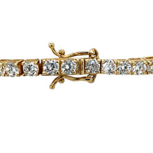 Load image into Gallery viewer, Add a touch of elegance and sparkle to your jewellery collection with this pre-owned 9ct yellow gold &amp; cubic zirconia set tennis-style bracelet, featuring:

Design: A classic tennis-style bracelet, showcasing a continuous row of shimmering cubic zirconia for a timeless and sophisticated look.
Material: 9-carat yellow gold, offering a warm and luxurious appeal.
Gemstones: Set with 3mm diameter cubic zirconia stones, adding brilliance and elegance.

