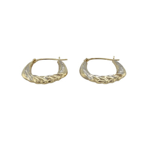 Add a touch of contrast and texture to your jewellery collection with these pre-owned 9ct yellow and white gold patterned twisted oval creole earrings, featuring:

Design: An elegant oval creole style with a twisted shape and detailed patterning, blending yellow and white gold for a stylish two-tone look.
Material: 9-carat yellow and white gold, offering a polished finish with beautiful contrast and visual interest.
Weight: Total weight of 0.50 grams, ensuring a lightweight and comfortable fit.