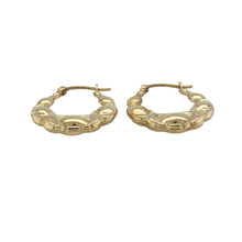 Load image into Gallery viewer, Add a playful twist to classic hoops with these pre-owned 9ct yellow gold bubble style creole earrings, featuring:

Design: A distinctive oval creole shape with a bubble-textured finish that catches the light for subtle sparkle and charm.
Material: 9-carat yellow gold, offering a warm, polished look with timeless appeal.
Style: The oval design adds a modern edge to a traditional silhouette, perfect for both everyday wear and special occasions.


