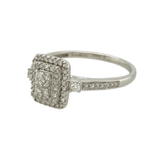 Load image into Gallery viewer, Bring timeless sparkle to your collection with this pre-owned 9ct white gold diamond set cluster ring, offering classic design with refined brilliance, perfect for special occasions or everyday elegance:

Design: A beautifully arranged cluster of diamonds forms the centrepiece of this ring, creating a bold yet graceful look with a timeless, radiant appeal.
Material: Made from 9-carat white gold, the polished finish enhances the bright, clean look of the setting and complements the diamonds&#39; sparkle.

