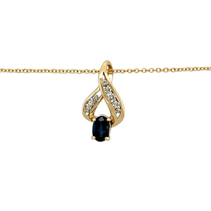 Preowned 9ct Yellow Gold Diamond & Sapphire Set Swirl Pendant on an adjustable 16" - 18" belcher chain with the weight 2.40 grams. The sapphire stone is 6mm by 4mm and the pendant is 1.9cm long