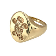 Load image into Gallery viewer, Preowned 9ct Yellow Gold Welsh Three Feathers Oval Signet Ring in size V with the weight 11.30 grams. The front of the ring is 2cm high
