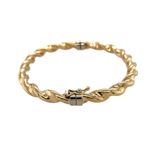 Load image into Gallery viewer, Preowned 9ct Yellow Gold Twisted Hinged Bangle with the weight 7.10 grams. The bangle width is 6mm and the bangle diameter is 6cm
