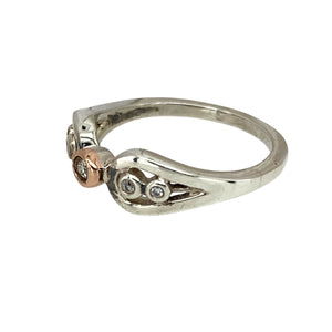 Preowned 925 Silver and 9ct Rose Gold & White Topaz Set Clogau Ring in size K with the weight 2.50 grams. The center stone is approximately 2mm diameter