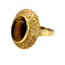 Load image into Gallery viewer, Preowned 18ct Yellow Gold &amp; Tiger&#39;s Eye Oval Cut Stone Weave Detail Ring in size O with the weight 7.60 grams. The tiger&#39;s eye stone is 14mm by 10mm
