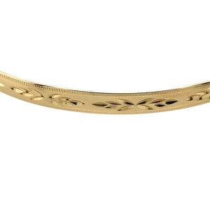 Preowned 9ct Yellow Solid Gold Patterned Bangle with the weight 7 grams. The bangle width is 5mm and the bangle diameter is 6.7cm