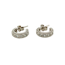 Load image into Gallery viewer, Add a touch of elegance to your jewellery collection with these pre-owned 18ct white gold and cubic zirconia set half hoop stud earrings, featuring:

Design: Classic half hoop stud earrings, set with sparkling cubic zirconia for a timeless and sophisticated look.
Material: Crafted from 18-carat white gold, offering a sleek and luxurious finish.
Weight: A well-balanced 3.40 grams, ensuring durability while remaining comfortable to wear.
A versatile and stylish accessory, perfect for adding subtle sparkle to 
