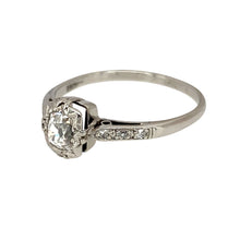 Load image into Gallery viewer, Add a touch of vintage elegance to your jewellery collection with this pre-owned 18ct white gold &amp; old cut diamond set vintage solitaire ring, featuring:

Design: A classic vintage solitaire ring with an old cut diamond centre stone, complemented by three small diamonds on each shoulder for added sparkle.
Material: 18-carat white gold, offering a timeless and sophisticated finish.
Diamond Detail: The old cut diamond enhances the ring&#39;s vintage charm, while the shoulder diamonds provide extra brilliance.
Siz
