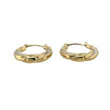 Load image into Gallery viewer, Add a touch of elegance to your jewellery collection with these pre-owned 9ct yellow and white gold patterned twist hoop creole earrings, featuring:

Design: Stylish twist hoop creole earrings with a delicate patterned finish for added texture and sophistication.
Material: 9-carat yellow and white gold, creating a beautiful two-tone contrast.
Weight: A lightweight 1.60 grams, ensuring comfort for everyday wear.
A versatile and refined accessory, perfect for adding subtle detail to any outfit.
