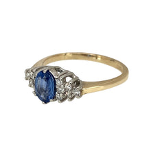 Load image into Gallery viewer, Add a touch of timeless elegance to your jewellery collection with this pre-owned 9ct yellow gold diamond &amp; sapphire set ring, featuring:

Design: A sophisticated ring showcasing a deep blue sapphire accented by sparkling diamonds for a classic and refined look.
Material: 9-carat yellow gold, with the stones set in white gold to enhance their brilliance.
Gemstone: Features a 6mm by 4mm sapphire, providing a rich and eye-catching focal point.
Size &amp; Weight: Designed in size I, with a well-balanced weight of 
