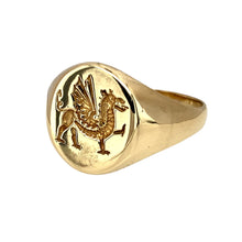 Load image into Gallery viewer, Add a bold and symbolic piece to your jewellery collection with this pre-owned 9ct yellow gold Welsh Dragon oval signet ring, featuring:

Design: A classic oval signet ring featuring the iconic Welsh Dragon, symbolising strength and heritage.
Material: 9-carat yellow gold, offering a rich and timeless appeal.
Size &amp; Weight: Designed in size U, with a solid weight of 5.30 grams for a durable and comfortable fit.
Front Dimensions: Measures 14mm high, making it a striking yet sophisticated statement piece.
