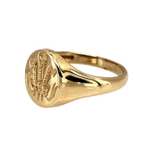 Load image into Gallery viewer, Add a classic and symbolic piece to your jewellery collection with this pre-owned 9ct yellow gold Welsh Three Feathers oval signet ring, featuring:

Design: A traditional oval signet ring engraved with the Welsh Three Feathers emblem, representing heritage and pride.
Material: 9-carat yellow gold, offering a warm and timeless appeal.
Size &amp; Weight: Designed in size N, with a well-balanced weight of 2.30 grams for a comfortable fit.

