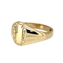 Load image into Gallery viewer, Add a classic and elegant piece to your jewellery collection with this pre-owned 9ct yellow gold patterned oval signet ring, featuring:

Design: A timeless oval signet ring, enhanced with intricate patterning for added character and style.
Material: 9-carat yellow gold, offering a warm and sophisticated appeal.
Size &amp; Weight: Designed in size N, with a solid weight of 3.80 grams for a durable and comfortable fit.
Front Dimensions: Measures 11mm high, making it a refined yet noticeable piece.

