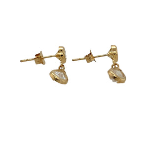 Add a touch of sparkle and elegance to your jewellery collection with these pre-owned 9ct yellow gold & cubic zirconia set drop earrings, featuring:

Design: Stylish drop earrings, featuring delicate teardrop-shaped cubic zirconia for a refined and sophisticated look.
Material: 9-carat yellow gold, offering a warm and timeless appeal.
Gemstones: Each earring is set with a 5mm by 3mm teardrop-shaped cubic zirconia, adding brilliance and elegance.
Weight: A lightweight 0.80 grams, ensuring comfort for everyda