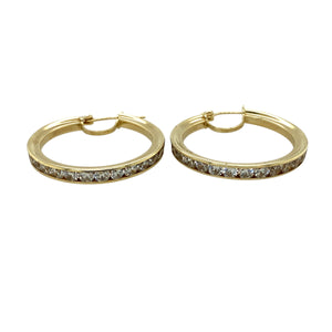 Add a touch of sparkle and elegance to your jewellery collection with these pre-owned 9ct yellow gold & cubic zirconia set hoop creole earrings, featuring:

Design: Classic hoop creole earrings, adorned with cubic zirconia for added brilliance and sophistication.
Material: 9-carat yellow gold, offering a warm and timeless appeal.
Gemstones: Set with cubic zirconia, providing a dazzling and refined finish.
Weight: A substantial 6.10 grams, ensuring durability while remaining comfortable to wear.
