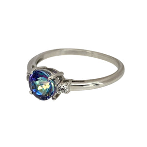 Add a unique and vibrant touch to your jewellery collection with this pre-owned 9ct white gold mystic topaz & cubic zirconia set ring, featuring:

Design: A stunning mystic topaz ring, accented with sparkling cubic zirconia for added brilliance.
Material: 9-carat white gold, offering a sleek and modern appeal.
Gemstones: Features a 6mm diameter mystic topaz-coloured stone, displaying captivating iridescent hues, complemented by cubic zirconia accents.
Size & Weight: Designed in size N