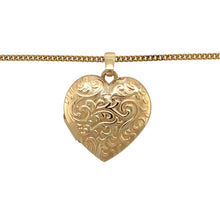 Load image into Gallery viewer, Add a sentimental and elegant piece to your jewellery collection with this pre-owned 9ct yellow gold patterned heart locket pendant necklace, featuring:

Design: A classic heart-shaped locket, adorned with an intricate patterned finish for added charm and elegance.
Material: 9-carat yellow gold, offering a warm and timeless appeal.
Size &amp; Weight: The pendant measures 2.7cm long including the bail, with a substantial weight of 7.20 grams, ensuring a high-quality feel.
Chain: Paired with a 20-inch curb chain,
