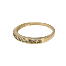 Load image into Gallery viewer, Add a touch of sparkle and elegance to your jewellery collection with this pre-owned 9ct yellow gold &amp; diamond set band ring, featuring:

Design: A classic band ring, adorned with dazzling diamonds for a refined and sophisticated look.
Material: 9-carat yellow gold, offering a warm and timeless appeal.
Gemstones: Set with approximately 0.25ct of diamond content in total, providing brilliance and elegance.
Size &amp; Weight: Designed in size P, with a lightweight yet durable 1.10 grams for a comfortable fit.
