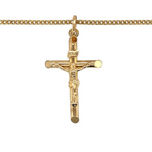 Load image into Gallery viewer, Add a meaningful and timeless piece to your jewellery collection with this pre-owned 9ct yellow gold crucifix pendant necklace, featuring:

Design: A classic crucifix pendant, symbolising faith and devotion.
Material: 9-carat yellow gold, offering a warm and enduring appeal.
Size &amp; Weight: The pendant measures 4.1cm long including the bail, with a substantial weight of 5.90 grams, ensuring a high-quality feel.
Chain: Paired with an 18-inch curb chain, providing a stylish and comfortable fit.
A beautifully c
