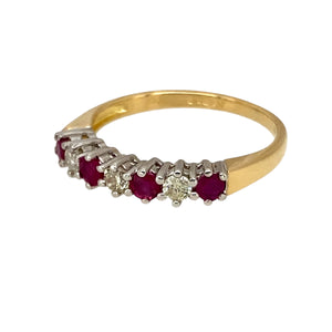 Add a touch of timeless elegance to your jewellery collection with this pre-owned 18ct yellow gold diamond & ruby set band ring, featuring:

Design: A classic band ring, adorned with alternating diamonds and rubies for a refined and sophisticated look.
Material: 18-carat yellow gold, with the stones set in white gold to enhance their brilliance.
Gemstones: Features approximately 0.15ct of diamond content in total, complemented by 2mm diameter ruby stones, adding a vibrant touch of colour.
